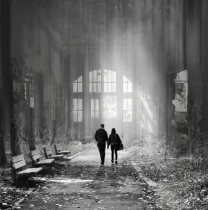A double exposure black-and-white image of a couple walking through an abandoned, decaying hall filled with mist and sunlight, evoking a sense of nostalgia and rebirth.